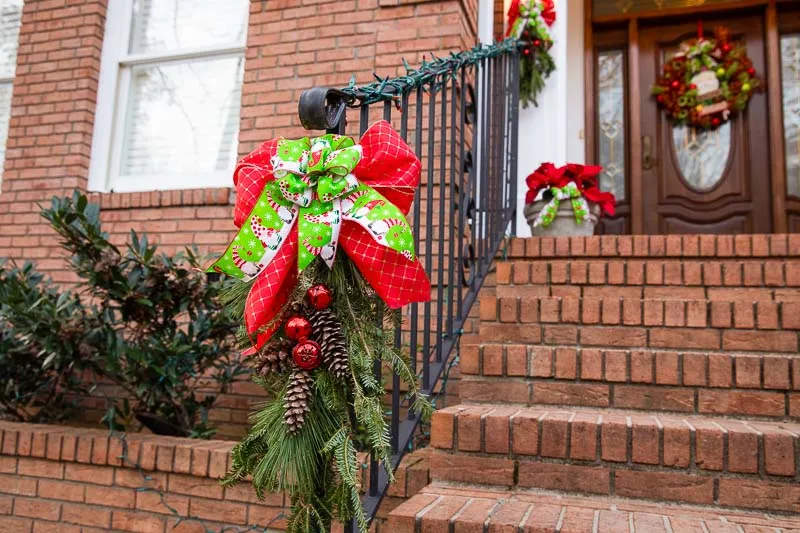 Garland across a portico with a wreath above